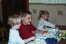 Madeline, Matthew, and Hayley coloring eggs